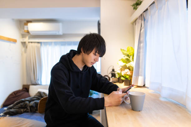 istock Young handsome man relaxing at home 1209743813