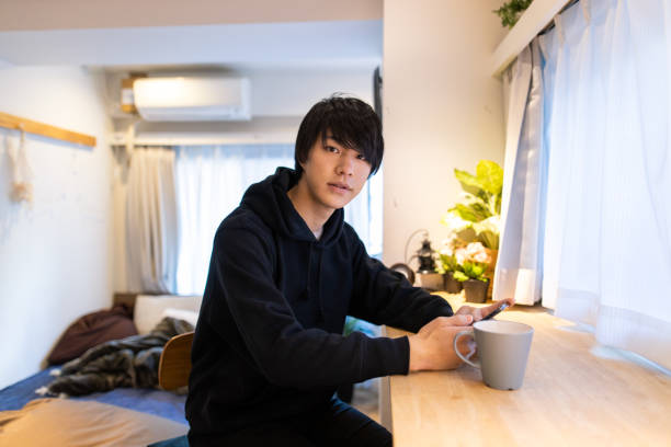istock Portrait of young handsome man at home 1209743833