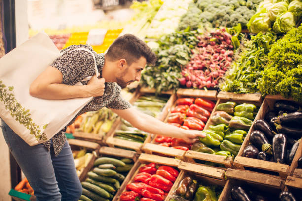 istock Man choosing vegetables at farmer´s market 1209745013