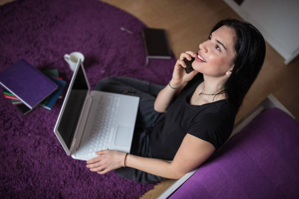 istock Student talking on the phone with friends 1209747498