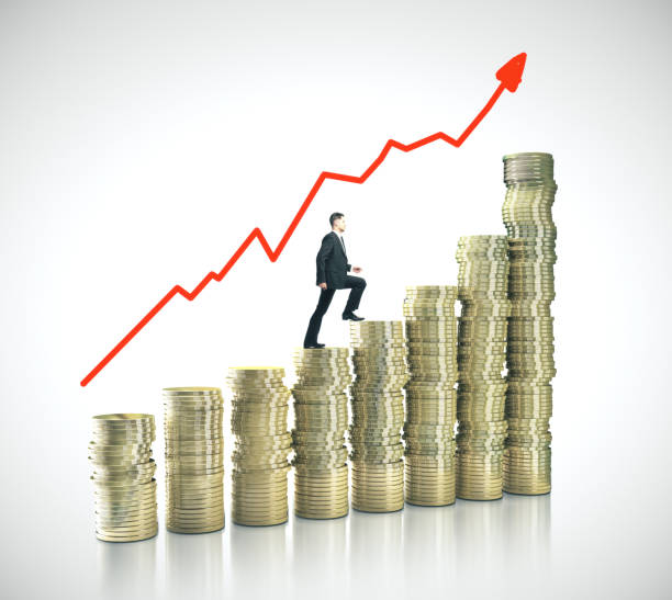 istock Businessman on gold coins in form chart 1209750947