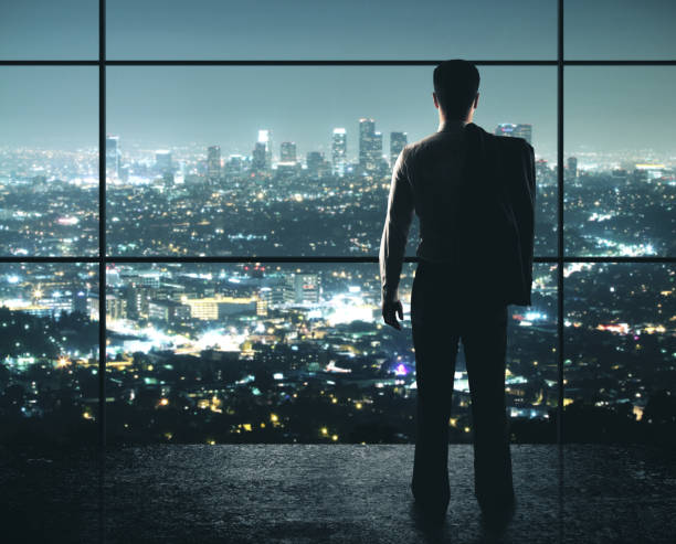 istock Businessman standing in office 1209751637