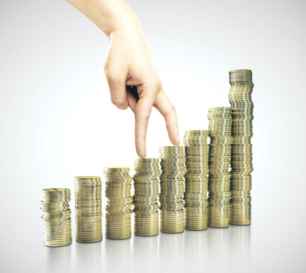 istock Businessman hand walking on gold coin 1209751647