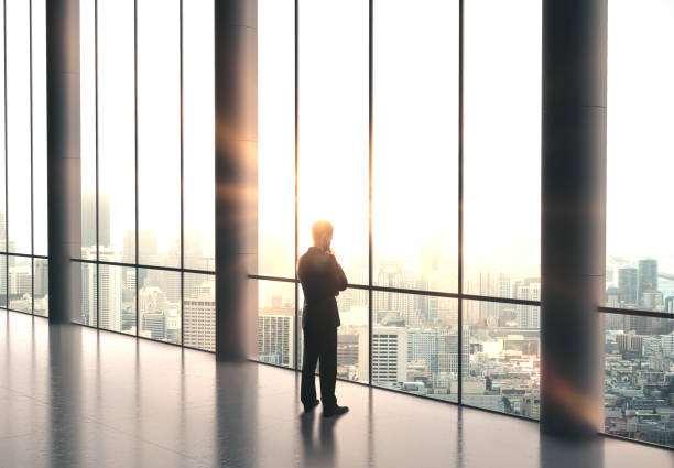istock Businessman standing in office 1209751678