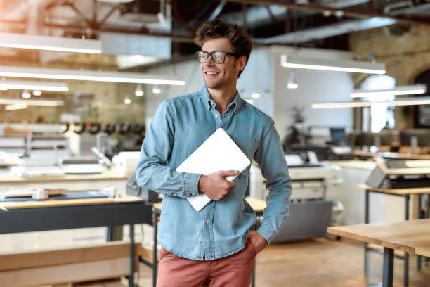 istock Just best, just legendary. Young businessman posing in office 1209753056