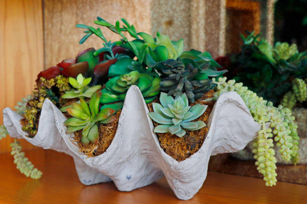 istock Decoration artificial flower in the pot on table - vintage effect style 1209754876