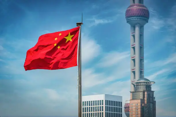 Photo of Shanghai Chinese Flag In Front of Oriental Pearl Tower China