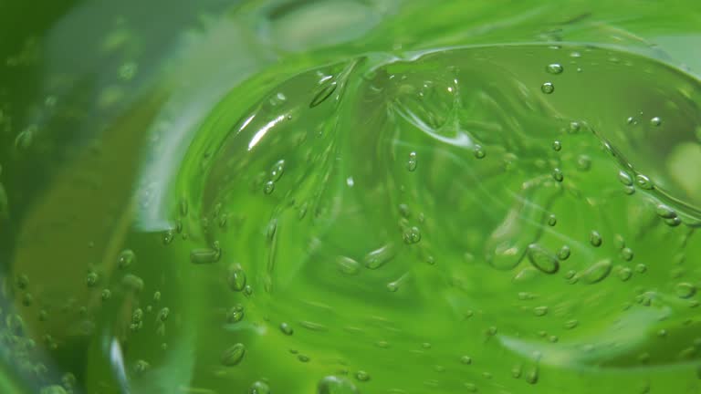 Side view rotation of Aloe vera gel moisturizer texture close up shot