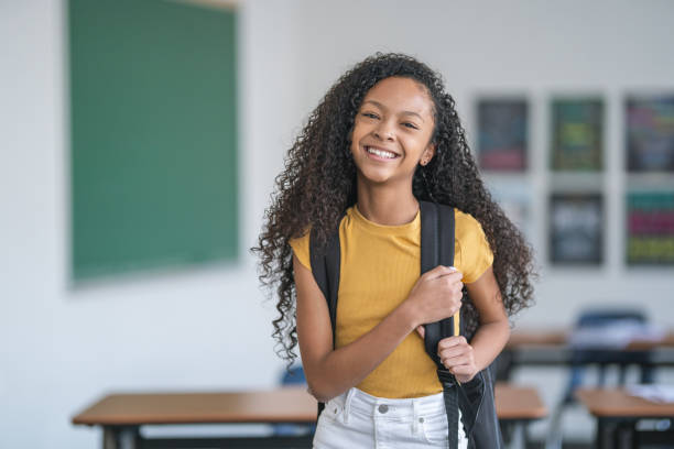 istock Portrait of a mixed race elementary school girl 1209763657