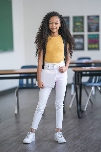 istock Portrait of a mixed race elementary school girl 1209763659