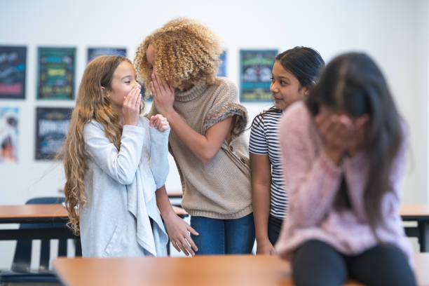 istock Elementary age girl bullying classmate 1209763689