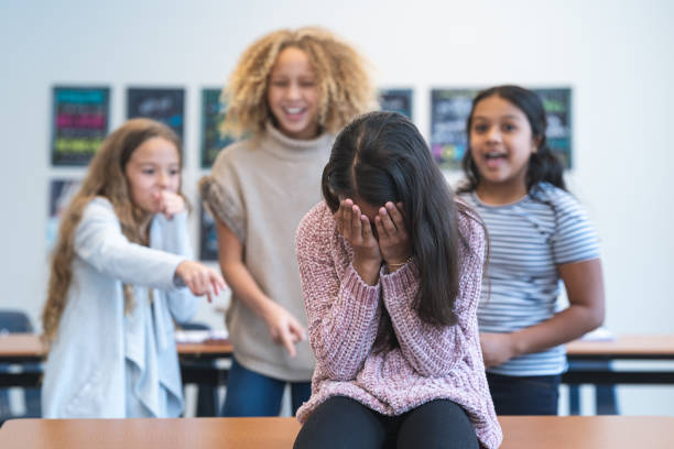 Elementary student being bullied by female classmates