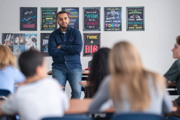 istock A young male teacher in a classroom 1209763723