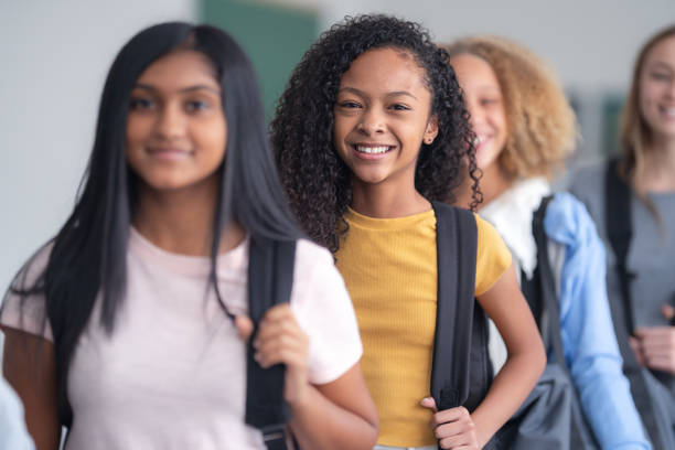 istock A portrait of junior high students standing in a line 1209763740