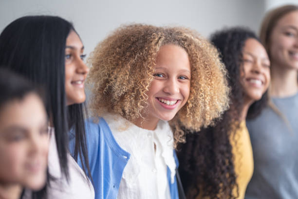 istock A portrait of junior high students standing in a line 1209763746
