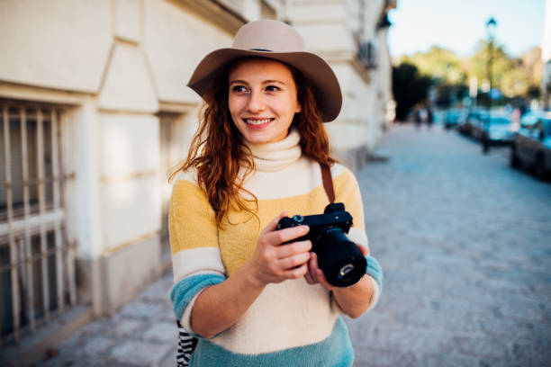 istock Happy girl on a journey taking photos 1209763947