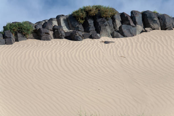 istock Gobi Desert Singing Sand Dunes black stones 1209766201