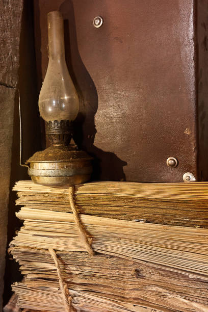 istock kerosene lamp on the old paper 1209769937