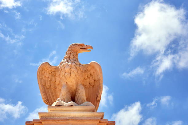 istock Statue of an eagle against the sky right 1209771918