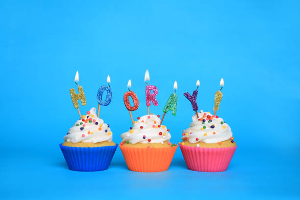 istock Birthday Cupcakes With Candles That Say Hooray 1209772144