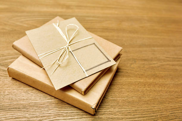 istock Stack of envelopes from craft paper on a wooden 1209774195