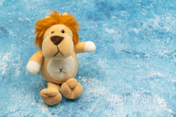 istock Stuffed lion close up, on colorful background. 1209774349