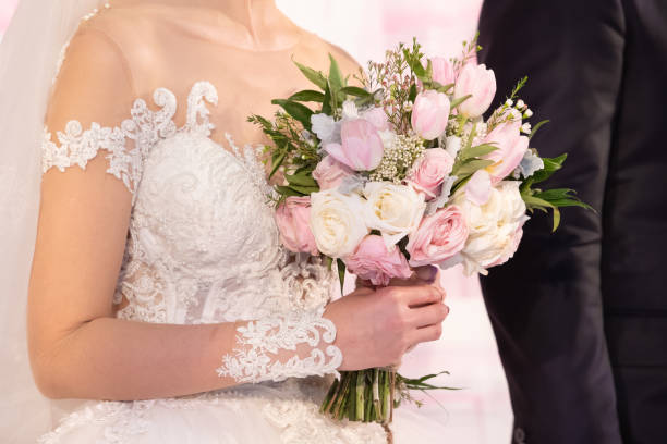istock The bride holding flowers 1209777253