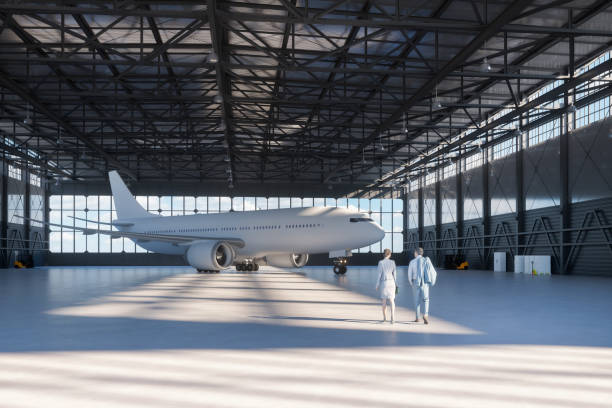 istock Business couple in airplane hangar 1209785382