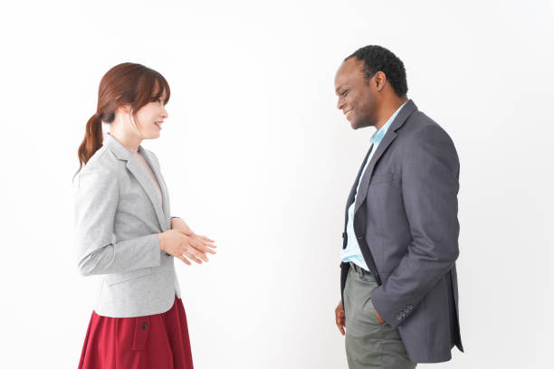 istock Two business person exchange opinions in the office 1209788621