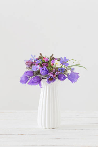 istock bouquet of spring violet flowers on white background 1209799731