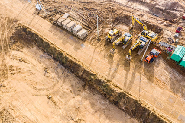 istock heavy machinery on a building construction site. aerial view 1209801659