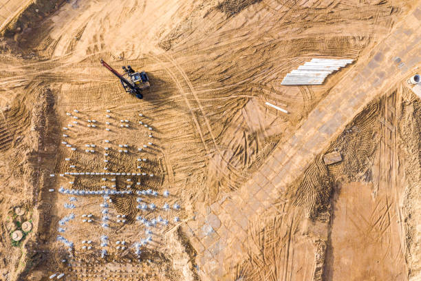 istock pile driver on construction site. aerial top view 1209802179