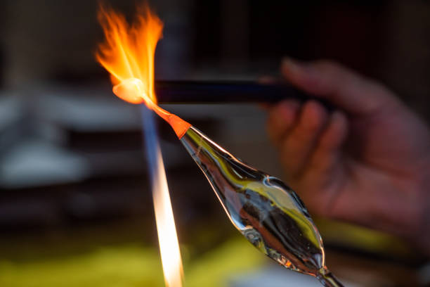 istock Artist works on glass with fire 1209802876