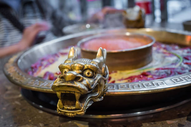 istock Chengdu Sichuan Hot Pot close up with dragon head sculpted handles 1209802915