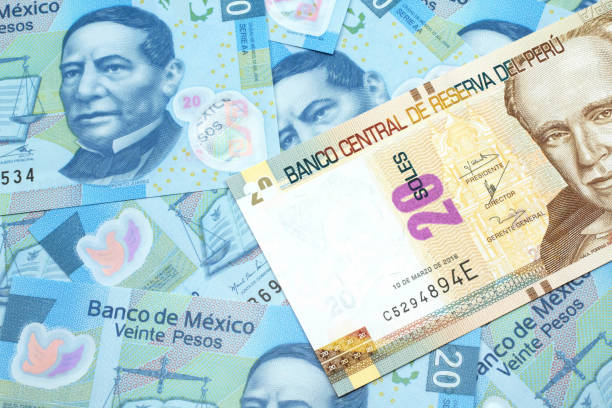 istock A twenty Peruvian sol bank note one a bed of Mexican twenty peso bank notes 1209806072