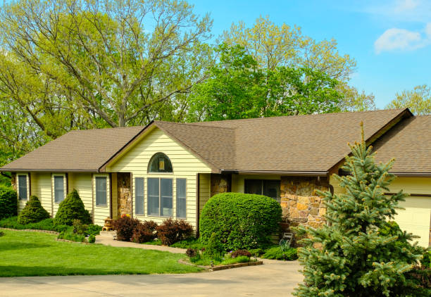 istock Midwestern house in spring; blue sky in background 1209806280