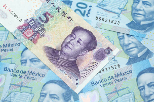 istock A Chinese five yuan note on a background of Mexican peso bills 1209806344