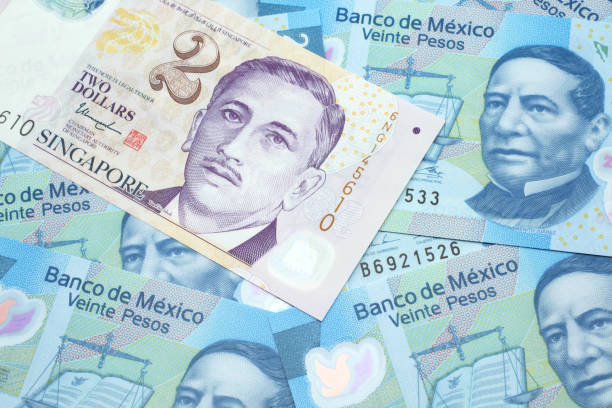 istock A two dollar bill from Singapore with Mexican twenty peso bank notes 1209806391