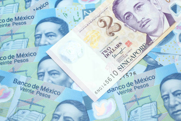 istock A two dollar bill from Singapore with Mexican twenty peso bank notes 1209806411