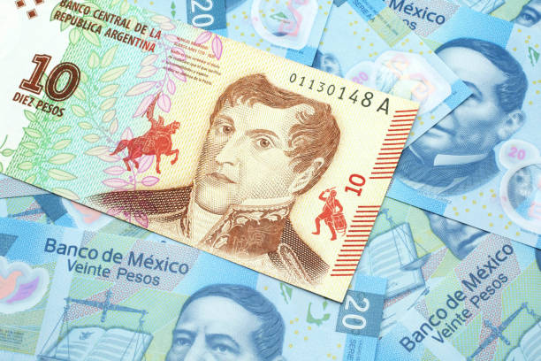a ten peso bank note from argentina with mexican twenty peso bank notes - argentina mexican pesos currency finance imagens e fotografias de stock