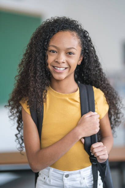 istock Portrait of smiling mixed race elementary school girl 1209807832