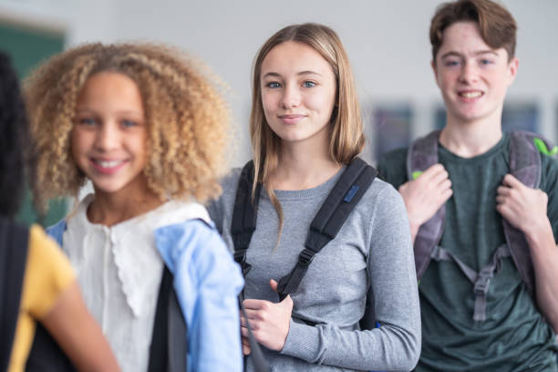 istock A portrait of junior high students standing in a line 1209808023