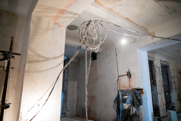 istock A lot of Internet, Ethernet UTP cables and electrical cables with labels without cable trays are temporary installed on the walls  in an apartment of data center during on the construction, overhau 1209810313