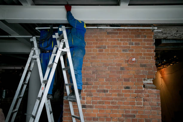istock Workers are installing plasterboard drywall for gypsum walls in apartment is under construction, remodeling, renovation, extension, restoration and reconstruction. 1209810382