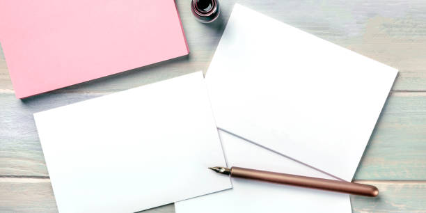 istock Stationery mock-up with an ink bottle and a nib pen. Blank greeting cards or invitations, overhead panoramic shot 1209810607