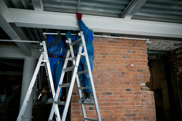 istock Workers are installing plasterboard drywall for gypsum walls in apartment is under construction, remodeling, renovation, extension, restoration and reconstruction. 1209810748