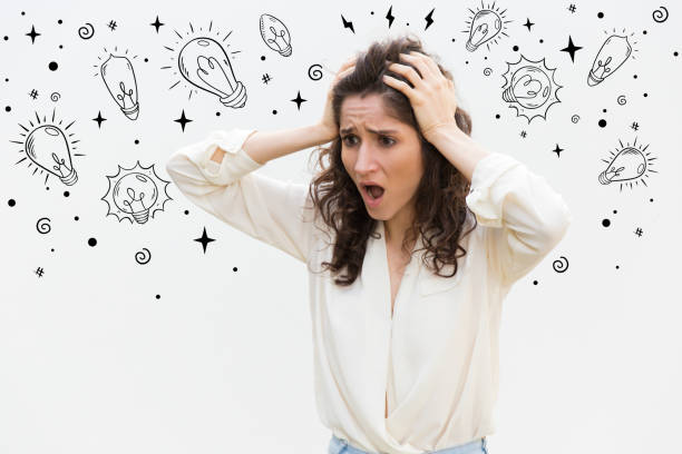 istock Stressed woman holding hands on head 1209812408