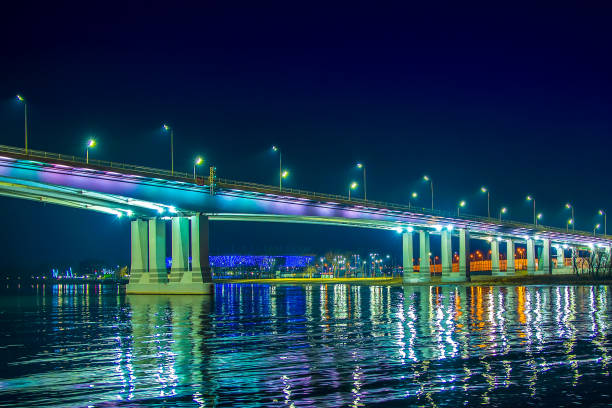 istock Bridge over the river with beautiful lighting. Night landscape with bridge 1209812420