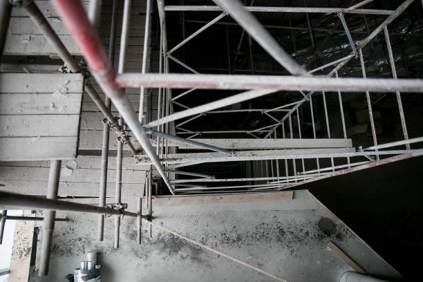istock Scaffolding and wall plastering in buildings are under construction 1209813920