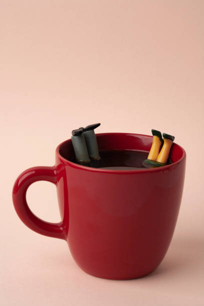 istock miniature man and woman falling in coffee 1209816203